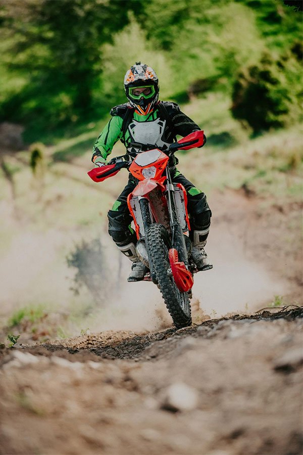 A man riding an enduro motorbike