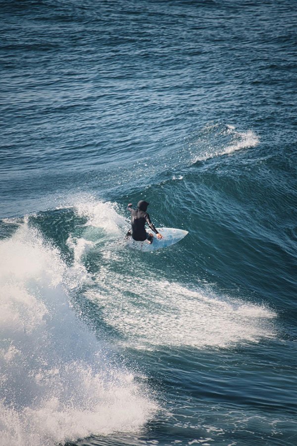 A man surfing on a wave