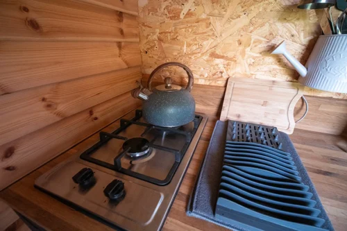 The Nook Shepherd Hut - Kettle on top of stove top