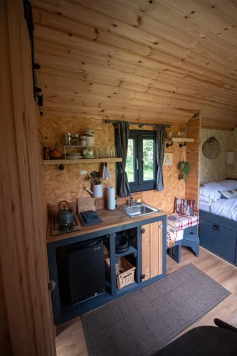 The Nook Shepherd Hut - The kitchen area with sink and stove top