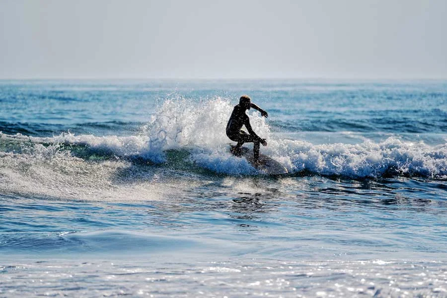 A man surfing on a wave